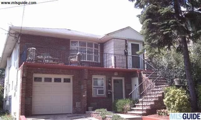 Brick 2 Family with garage on 38X113 lot size. Stunning Downtown N.Y.C. southern views of River & Skyline from 2nd floor. Front Balcony, plus yard with expendable patio. Both apts have renovated tiled bathrooms from 2005, renovated kitchen on 2nd floor with HWFs, Hot water heater- 2005, coin operated washer/dryer.Quiet non-thru street, near NYC transportation with 10 minute commute.