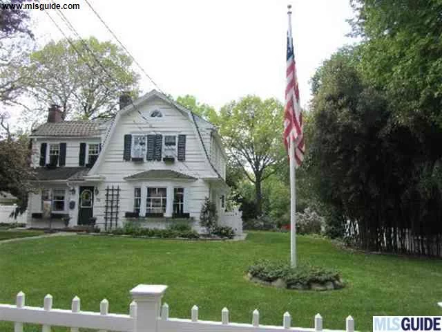 Beautiful 1929 Dutch Colonial. Kitchen is unique with original tiled walls and a 1929 pocelin/cast iron stove, other appliances have been updated, butcher block counter and granite island. Original walk-in pantry, butler pantry, and an in wall ironing board leads into the dining room. Lvg rm has frpl and french drs to 3 season porch. Master bath has steam shower, jacuzzi, heated flr, marble sink and stain glass window. Cedar closet in master. Finished bsmt w frpl and bth. This is truely a one of a kind home.