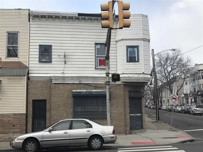 Make it your own. Inside gutted. Total rehab job. Currently, commercial space on bottom and two 2-bedroom apartments on top. Additional floors can be added via re-development area plans.