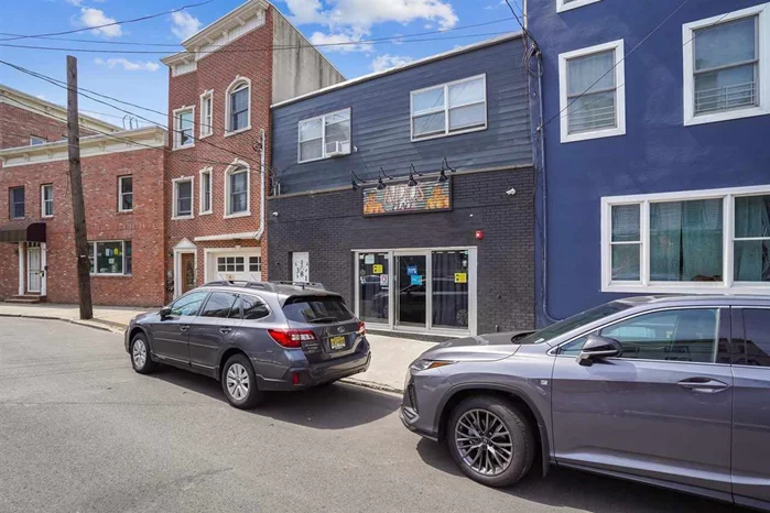 This unique property is nestled on a quiet street in desirable downtown Jersey City, just opposite the newly renovated pocket park, Village Park. It is a 2 story building that is approximately 1174 square feet on the ground floor, previously used as a tavern, but now just currently equipped with a commercial kitchen ideal for a BYOB restaurant, or conversion to office, storefront, or an apartment to make this a 2 family dwelling. The second floor is currently a spacious 2 bedroom apartment, approximately 1456 square feet. This property is ideal for an owner occupant, investment or if preferred, combine both floors for a very spacious 2630 square foot 1 family home. There are many possibilities for a creative buyer who sees the potential to shape their own vision for a home or investment that is truly unique!