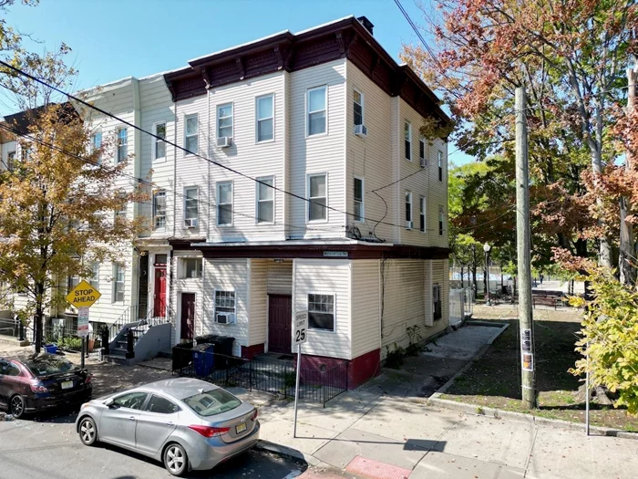 Three family residential investment property in the Hamilton Park neighborhood of Downtown Jersey City. The position on the end of the block allows the corner building to have windows on three sides, bringing in more sunlight and allowing better layouts on each floor. Currently three apartments, one per floor, plus an unfinished basement. The first floor is a one bedroom apartment with a private outdoor patio which faces the park behind the building. This apartment has a door in the hallway like the others, but also has a door in the front of the building which can be used to enter the apartment directly, while also serving as a way to open up more during nice weather. Apartment two on the second floor is a two bedroom with a separate dining and living room area plus large (long) closets between the bedrooms. The top floor apartment has a third bedroom between the two bedrooms, that may be used as an office or child's room. Each apartment has a separate HVAC system using forced hot air heating. Great opportunity for long term investment or condo conversion!