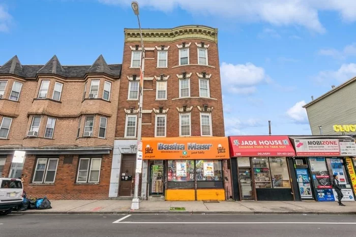 Investors dream opportunity to own a desirable and impressive income-producing 4 Unit Mixed Use property in Jersey City's Journal Square area. Solid Brownstone building with first floor retail and three apartments above. Each apartment is approximately 1300 sq ft with 4 generous bedrooms and 1 bath as well as laundry hookups. Located on prime West Side Avenue on a 28x100 lot. All separate utilities. Current rent is below market with significant upside potential. This is a fantastic investment, with steady positive cash flow with over 5% CAP return As Is. And easily projected 7-8% CAP return.  The location is near various restaurants, shops, grocery stores, top charter schools, Saint Peter's University, NJCU, Houses of Worship (Churches, Mosques and Synagogues), and essential businesses. A short distance from beautiful Lincoln Park. A commuter's dream with a bus stop in front of the building to the PATH at Journal Square and easy access to NJ Turnpike and Route 440. Don't miss out on this amazing opportunity, schedule your private tour today!