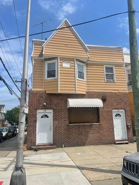 Corner building for sale. Great opportunity to open your own business and collect rental income from the second fl. apartment. First floor was used as a tavern. Second floor features 3 bedrooms, L/R, D/R