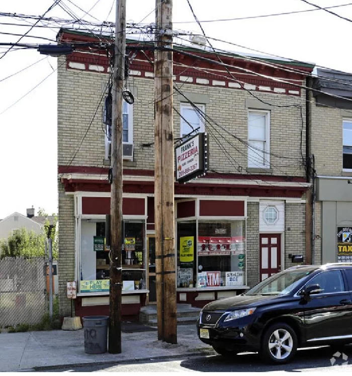 Excellent investment opportunity to own a mixed use building, 1st floor operating as a busy Pizzeria for more than 50 years! Second floor has rental income from a beautiful 2/3 bedroom apartment with private balcony. Located just a short walk to the Light Rail and hundreds of new apartments.