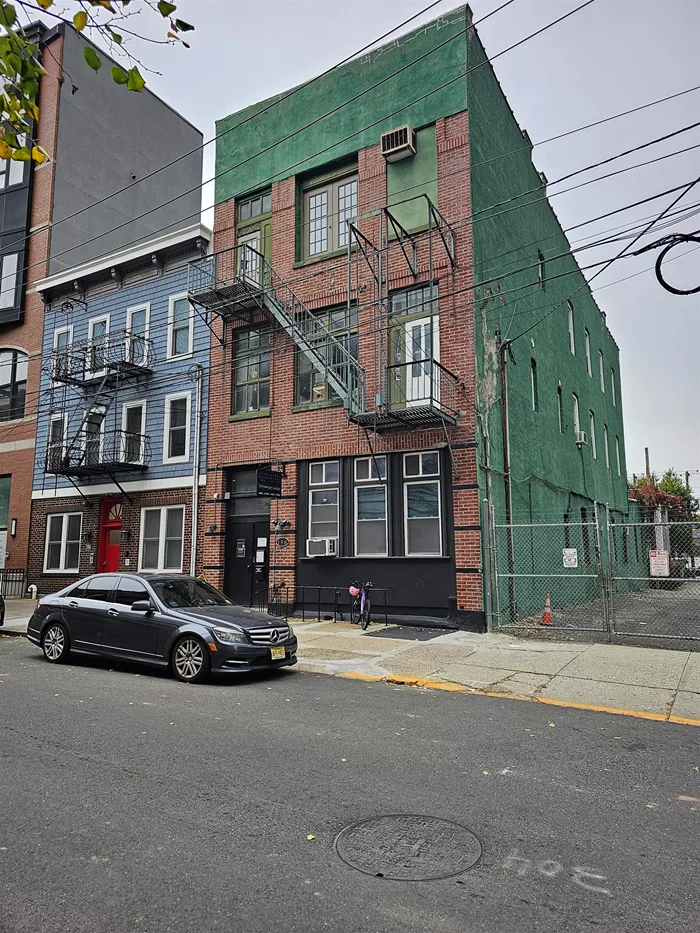 A rare opportunity for an investor or owner/user. 3-Story brick building in the heart of Downtown Jersey City just one block from Grove St. Path Station. Approx. 6750 sq. ft. It is located in the Morgan/Grove/Marin Redevelopment Plan allowing the development as of right an additional story making the building 4-story. Ideal for residential, and commercial. Attractive zoning, currently 3-story. Top floor is 2300 sq. ft. loft space and is vacant just in case a prospective buyer would like to be owner/user for the building. Ideal for work space or live-in. First floor is currently a dance school. Rent is $5200/Month. Second Floor is 2-BR, rented for $3950/month. It will not last. Please call for more information and private showing.