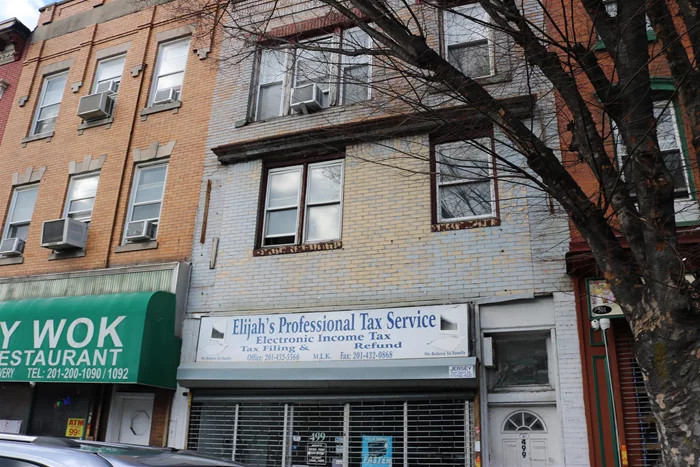 Great opportunity to own building and office space below and 2/2br apt above for rental income