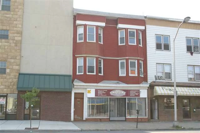 Four 2 Bedroom apartments, one studio, one commercial unit. Building is vacant and needs rehab. Owner is licensed real estate salesperson.