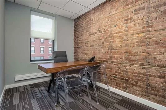 Beautiful windowed office facing Hudson Street, exposed brick and can be combined with office next door with pocket door. Welcome to Eureka luxurious co-working experience with private offices. Fully Furnished Office includes: Your own Lock and Key, Desk, chair, filing cabinet, guest chair, VOIP phone and blazing fast wi-fi. Keyless building entry, security cameras, conference room with Apple TV to project from laptop. Several common areas for waiting and lounging, kitchenette with coffee station, microwave and fridge, two Live walls of plants, your own mailbox and restrooms on each floor. Available Now with Flexible lease terms. Excellent location across from Starbucks in downtown Hoboken's business district, 1 block from Washington St and the PATH, Ferry Terminal, Taxis, NJ Transit Trains and Buses which makes it an ideal spot for Easy commute.