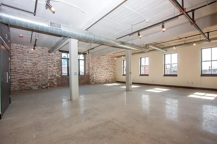 This expansive 1, 587 SQ.FT live-work loft faces south. It has oversized Pella windows lining the entire unit, offering ample sunshine. All units in the Vito A. Lofts feature vast open floorplans finished with polished concrete flooring and exposed brick. Spacious kitchen with Whirlpool stainless steel appliances, Caesarstone counters and custom cabinetry are a few more details that define your personal live-work loft. These unique spaces offer an airy feel with approx. 10-15 ft. ceiling height outlined with exposed ducts, and Wac track lighting. Units are pre-wired with Verizon FiOS, Butterfly video intercom and equipped with washer and dryer hookup. Located in downtown, Jersey City just two blocks to the Grove Street PATH and Newark Ave pedestrian plaza. Treat yourself with the simplicity of a live-work loft that caters to your daily needs.