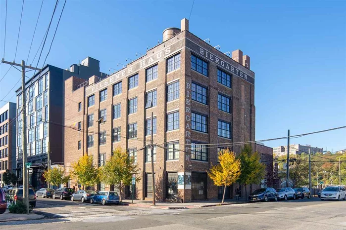 COMMERCIAL OFFICE SPACE. Designer loft office space- perfect individual or small group 2-3 persons located in the only loft commercial building in North Hoboken. With large casement/ industrial style windows,  Custom built in cabinetry and desks. Plenty of natural light, wide plank reclaimed hardwood floors, exposed brick and exposed timber beams, this loft style unit is perfect for an office, retail, health& wellness consultancy or medical space.  Move to the coolest new area of Hoboken for the price of a co-working space, you can have your own space!