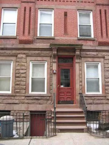 Brownstone unit with high ceilings on tree-lined Park Ave. Exquisite craftsmanship matched to your gourmet kitchen, with elegant wood cabinetry complemented by high quality granite counters and oversized breakfast bar (3 seats). Frigidare stainless steel pkg with Kohler & Moen faucets. Also features w/d combo & private storage in basement.