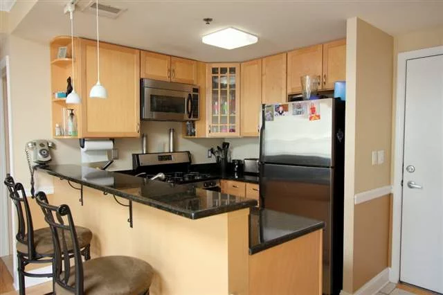 Bright 2BR/2BA with 1, 000 sq feet of living space in elevator building. Unit features stainless steel appliances, granite breakfast bar, oversized bathroom w/ Jacuzzi tub and double sinks in master suite, walk-in closet, skylight, crown molding, custom blinds, hardwood floors, CAC, W/D, deeded indoor parking, and storage unit. Roof was recently replaced. Close to transportation.