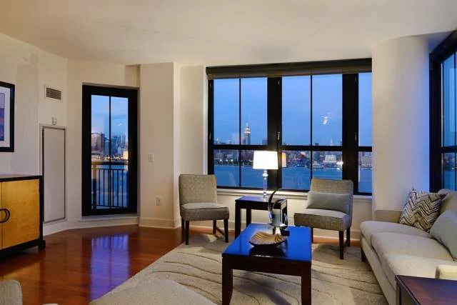 As good as it gets! Panoramic NYC views, a private terrace, on site garage parking and a fabulous southeastern corner location make this world class condo an urban dweller's dream. This 2 bedroom 2.5 bath has a fab floor plan,  floor to ceiling windows, chef's kitchen with granite counters, wood floors & luxe master bath,  The Maxwell waterfront community offers unmatched amenities; rooftop pool and Jacuzzi, gardens, residence club, fitness center, 24 hour concierge & shuttle to path station.