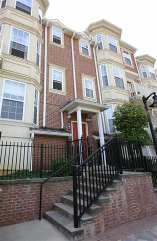 Beautiful 2 story 2 BR/2 BA townhome w/ many upgrades & amenities. Very large master BR, bth & walk-in closet upstairs. 2nd BR w/ full bath downstairs. Features tiled, full kitchen, balcony, wood flrs, carpeted BRs, custom crown molding & lighting thruout, track lighting, & recessed halogen lighting in kitchen, custom keypad light switches w/ dimming & scene modes, full sized W/D, custom elfa shelving above W/D, custom hunter blinds & window treatments. Prkg w/ custom shelving installed in garage.