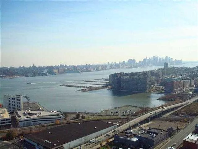 Spectacular NYC & Hudson River Views from this 15th floor home. Huge balcony also to compliment this view. All amenities included. NY transportation at front door, ferry and Light Rail access via shuttle service included. Swing pool, gym ($240 annually) valet service, laundry on each floor.