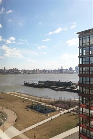 Maxwell Place, Hoboken's most sought out waterfront community. With Southern exposure, this 1390 sq ft 2 Br Condo is flooded with natural light. Your new home features chef's kitchen with granite counter tops, custom cabinets and SS appliances. Other features include large br's custom closet organizers, hardwood floors and NYC and Hudson river views. Community features 24 hr Concierge., state of the art gym, community room, pool, and landscaped roof top gardens. Commuter's dream!!