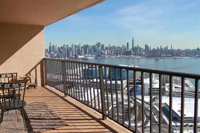 Renovated 1B/1B with direct Hudson River & NYC views from an open 100 sq ft tiled terrace. Open kitchen features stainless steel appliances and granite countertops. Bathroom has been renovated with marble tiles. Laundry room on every floor. This apartment has a boxy layout with lots of closet space! Building features a doorman, pool, gym, parking and free shuttle service to Hoboken. This beautiful home is move in ready!