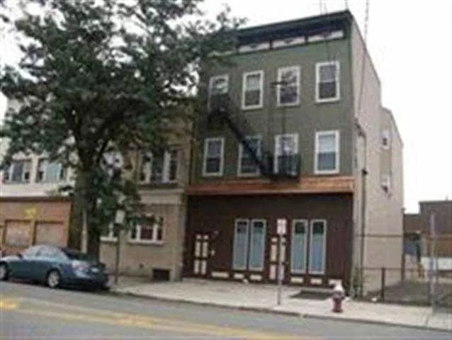 Location Location. 1.5 Block from W/Side LRT station. This is a beautiful gut renovation featuring 2BR/1BA walk-in pantry, private back yard, large tool shed, security system, hardwood floors, SS appliances, granite and washer/dryer. This home has loads of closets. Quiet street and just minutes to Jersey City Downtown financial district.
