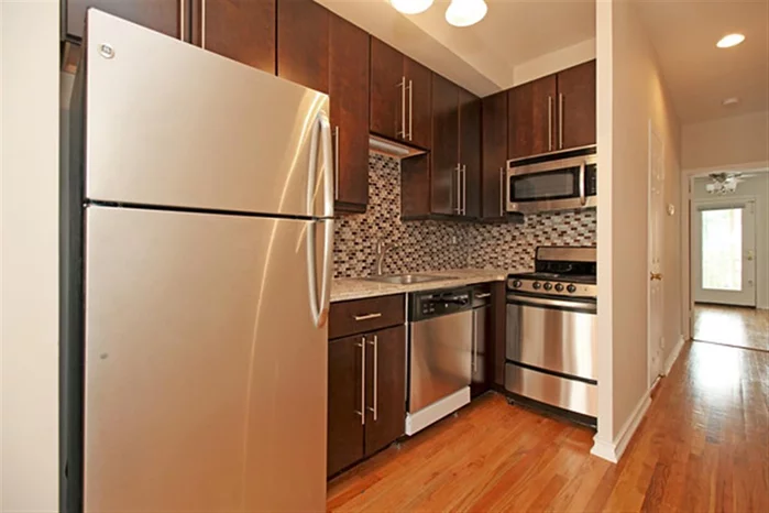 Newly renovated and well layed out condo features a spacious living room. Brand new kitchen cabinets with granite counter top and GE stainless steel appliances, bathroom with a new subway tiles, hardwood floor throught and terrace.