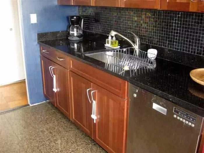 Kitchen w black granite/SS appliances Master bath w/ marble Full service doorman building. Transportation to NYC is a snap Free AM HOBOKEN PATH SHUTTLE