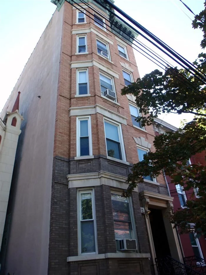 Incredibly spacious and bright 2 bedroom plus den on tree-lined Garden St. Leather walls and stained glass skylight welcome you to the building. Exposed brick, crown molding and hardwood floors keep the original feel through out the home. Large windows and a skylight in the kitchen keep this home sunny all day long and allow you to easily enjoy the NYC views. The large living / dining space open to the kitchen making this home great for entertaining. Centrally located, you'll have easy access to all Hoboken