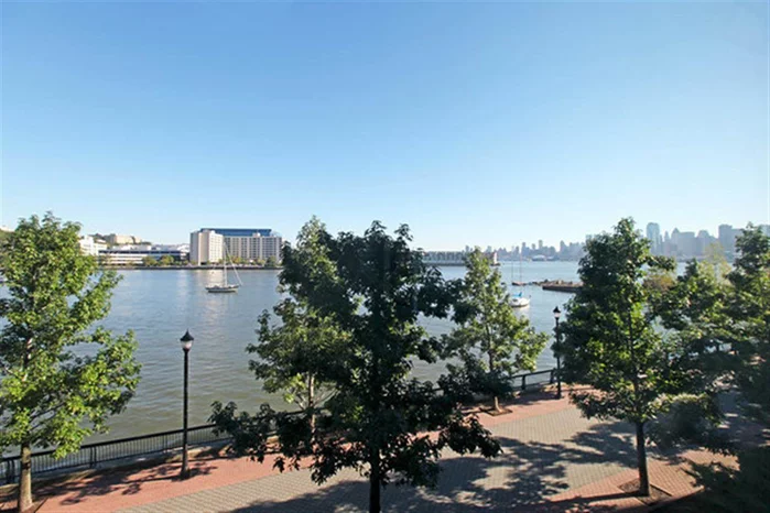 Fantastic midtown and Hudson River Views. Welcome to the Hudson Tea, one of Hoboken's most sought after waterfront communities. Home features include fantastic view, 12ft vaulted ceilings, 10 ft picture windows, granite counters, ss appliances and hw floors throughout. Community features 24 concierge, 2500 sqft state of start gym, and community room. Commuter's dream...ferry blocks away or take private shuttle to the path. 1 parking spot in parking deck included.Open House 11/23 1-3