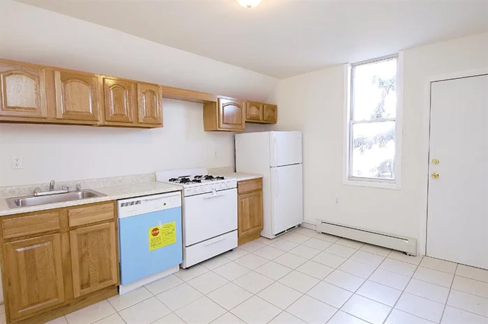 Nicely renovated condo in a rapidly appreciating Jersey City neighborhood, flexible layout with 1BR and EIK, washer and dryer in available in basement. Located on a tree lined block with common backyard. Easy commute to Manhattan and short walk to Danforth st light rail. 1 car garage in back included.