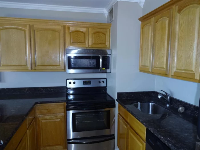 Granite island SS appliances Full NYC viewsFull service doorman building steps from LightRail Midtown bus practically at door! Private footbridge to tennis courts New Shuttle to PATH