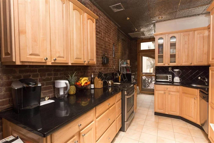 WOW! Fantastic 2BR/1.5Bth awaits you. With over 11 ft ceilings, exposed brick, and private deck, this is truly a place to call home. Kitchen features granite counters, ss appliances, and custom cabinets. Other features include central air, hardwood floors, and washer/dryer in home.