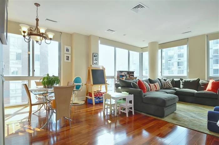 Breathtaking Southeast corner unit with spectacular Hudson River and Statue of Liberty Views! Huge floor to ceiling windows flood the home with natural light. Features include a split 2 Bed/ 2 Bath floor plan. A large living room/dining room area. An ultra modern kitchen, beautiful hardwood floors, and a garage parking spot in the building. Only steps away from light rail. Ferry and a short trip to NYC via path! OPEN HOUSE 4/12 1-3 PM & SUNDAY 4/13 1-4 PM.