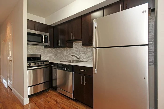 Newly renovated and well layed out condo features a spacious living room. Brand new kitchen cabinets with granite counter top and GE stainless steel appliances, bathroom with a new subway tiles, hardwood floor throught and terrace.