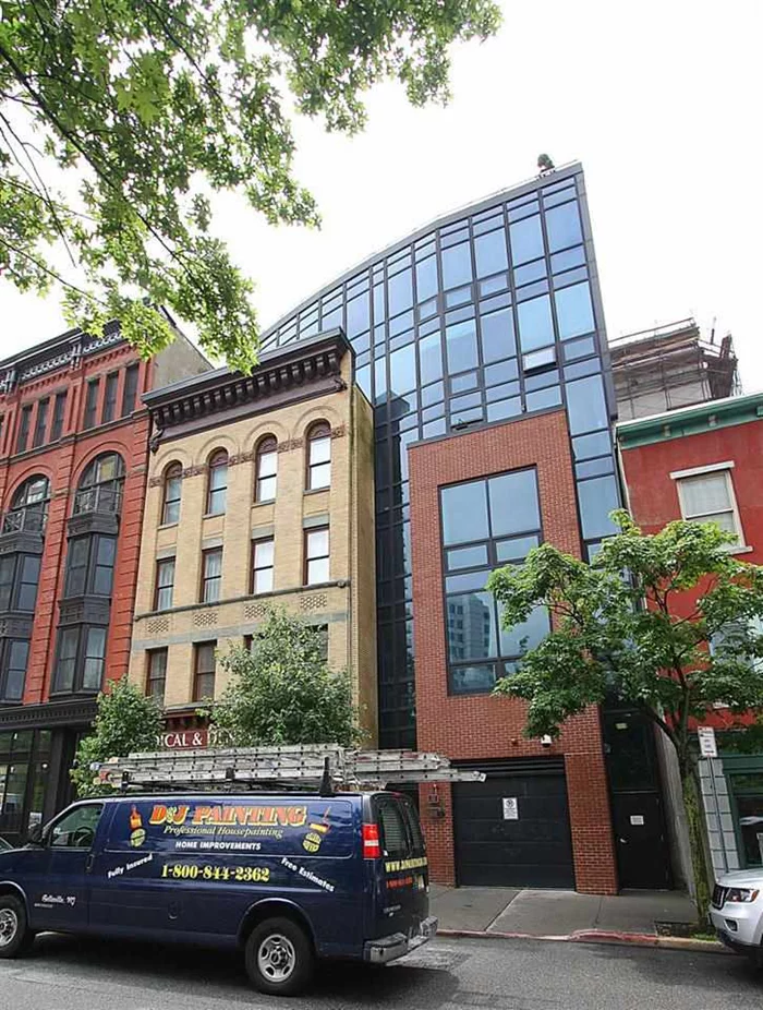 Gorgeous 2BR/2Bth + den in desirable downtown Jersey City! Condo features floor to ceiling windows providing for an abundance of natural light, exposed brick in living area, HW flrs through out, kitchen is highlighted w/SS appliances, granite counters & custom cabinets, master BR features en suite bath w/double vanity & walk in ELFA closet system. Updated 2nd bath, CAC & plenty of closet space. Walk to great restaurants, shopping & NYC trans & PATH. Unit is powered by Nest Thermostat & Nest Smoke/CO Alarm.