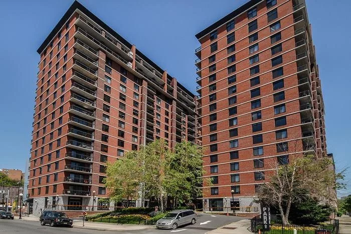 Terrific 2br/2ba SW corner unit in the Sky Club. Unit features, kitchen with lots of cabinet space, d/w, s/s appliances, breakfast bar and h/w floors. W/D conveniently in unit. Large living room w/separate dining area. Master bedroom with ensuite bath. 2nd bedroom with walk-in closet. Enjoy your balcony with sunset views. Bldg offers: 24hr concierge, courtyard, elevator, free shuttle to/from PATH, steps to NYC buses, LightRail and more! Onsite 25, 000 sq ft gym & garage parking offered for additional fee