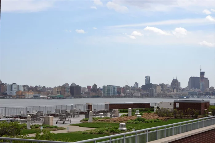 LUXURY WATERFRONT LIVING with sun filled south facing NYC and river views! Rarely available, sought after layout will capture your heart the moment you walk in. Stylish, spacious, top of the line 1750 sq ft, 2 bed + den can easily be converted to a true 3 bed, 3 bath + den, parking included. Distinct touches and upgrades throughout include custom built-ins, crown moldings, wall coverings and custom closets. Chefs kitchen with glass backsplash and breakfast bar opening to expansive dining and living room.