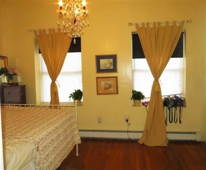 Picture yourself in this lovingly maintained, 2 BR condo just minutes from NYC! Condo comes with hardwood floors, 14-foot high ceilings, Jacuzzi tub, and an abundance of closet and storage space. Laundry room on premise. Located within walking distance of PATH trains to NYC, schools, shops, and parks.