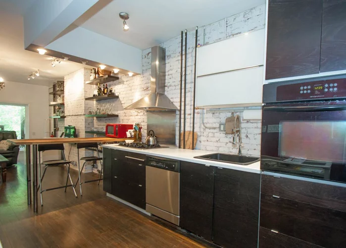 Brownstone living offers 2 bedroom, 2 bath duplex condo in Van Vorst Park area! Bright airy space with lots of natural light features gleaming hardwood floors & wood finishes throughout, SS appliances & dishwasher. A private deck & garden great for entertaining!