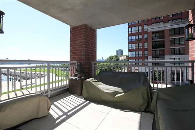 The ultimate in Luxury Living. Direct unobstructed NYC views from master br & living rm. Located on SE corner home is flooded w natural light. Relax on one of your 2 private balconies (one is approx 8x8). Home has been customized w control for smart home tech. Chef's kitchen features expansive breakfast bar custom cabinets & granite counters. Community features 24 hr concierge, 2 gyms, 2 pools, landscaped roof top gardens w BBQ's, TV & fireplace & 2 community rooms. Parking included