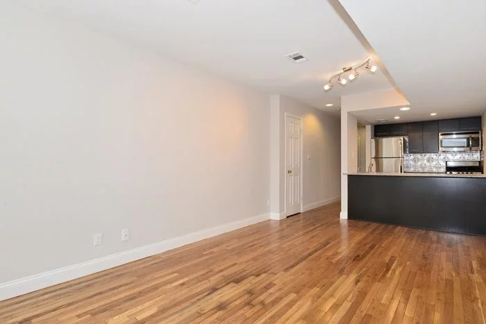 Newly renovated spacious studio located in downtown Hoboken featuring new espresso kitchen cabinets with a quartz countertop, stainless steel appliances, hardwood floors all throughout, a walk in closet, a bathroom with subway tiles, and a large private backyard. There is also convenient laundry in the building. And the location is close to New York transportation.