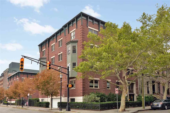 Beautiful 2Br, 2Ba corner unit w/NYC views and garaged prkg in one of Paulus Hook's most desirable tree-lined blocks. This high flr, bright, and spacious condo in a newer, boutique elev bldg has both south & east exposures w/tons of sunlight. High-end finishes include a gourmet kitchen w/top of the line ss appl's (Sub-Zero, etc), granite counters, hw flr's, gas fireplace, Jacuzzi tub, W/D in unit, C/A/C, custom closets, private storage, outdoor common area. Low maintenance fee!