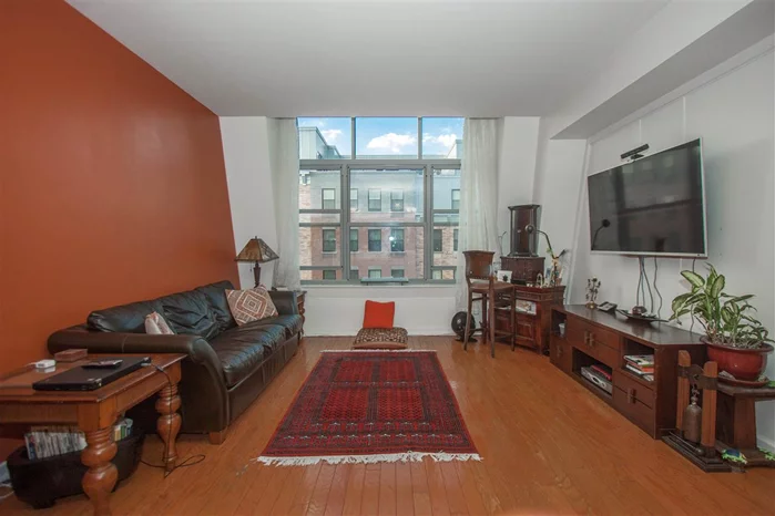 Beautiful penthouse, 2 bedroom 2 bath plus office in Paulus Hook. High ceilings, large windows, skylights & open layout to a kitchen with granite, stainless steel appliances, maple cabinets & breakfast bar. Gleaming wood floors, large bathrooms, walk-in closet, abundant storage, laundry, central air/heat. Close to NYC transportation. Very unique loft-style unit, a must see!