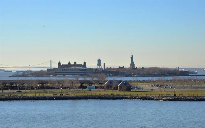 Exclusive Paulus Hook Condo; Gracious Urban Living; Actually on the Waterfront, 1404 SqFt 2Br (+90sf balcony) w SW exposure allows maximum natural light; Crown Moldings, HW flrs, upgraded bthrms + valet parking. Relax on privae balcony with direct views of Statue of Liberty, Ellis Island & Verrazano Bridge. Kitchen with custom cabinets, granite counters, s/s/ appliances + more. Finally a home that has the space for seperate living and dining areas. Large master, w built-ins + huge WIC, easily fits king bed, add'l furniture and a home office. Maint includes, heat +HW, 24 hr doorman, gym, Penthouse Skylounge, pool + common area WIFI.