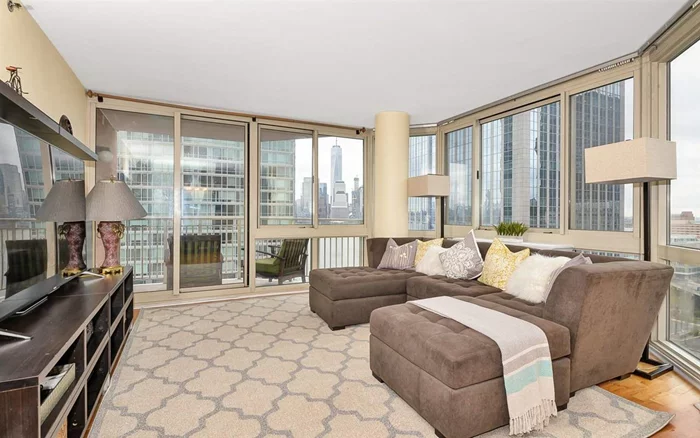 Gorgeous 3Br 2Ba with NYC & River views at Mandalay on the Hudson. Spacious living space, floor to ceiling windows and beautiful hardwood floors. Stainless steel appliances, laundry in unit and deeded parking. The Mandalay is a full service building and pet-friendly with 24 hr concierge, gym, pool, tot-lot, community room and BBQ area. Easy access to Newport Pavonia & Exchange Place PATH trains, Light Rail & Ferry.... Commuters dream!