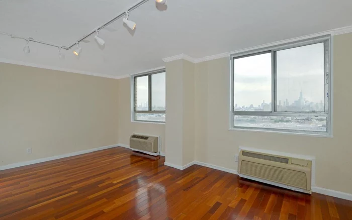 Enjoy the Panoramic NYC views from every window of this east facing home, featuring hardwood floors, granite countertops, and stainless steel appliances! The building offers 24 hour doorman, gym, pool, shuttle to the Hoboken PATH, deli, dry cleaner, and community room. Pet friendly. ALL utilities and property taxes included in maintenance fee. Located right next to Congress Street Light Rail. Close to Hoboken movie theater, Trader Joe's, ShopRite and many others.