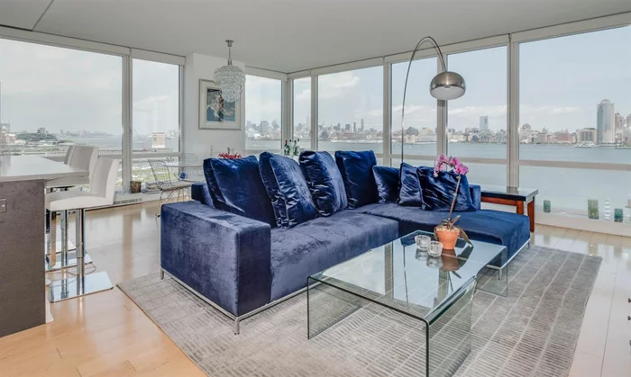 A rare opportunity! 42 story glass building offers 3 bed, 2.5 bath, NE corner unit with panoramic NYC view from GWB bridge to Verrazano bridge .Enjoy this view from wrapped around floor to ceiling windows & outdoor terrace.1591 sq ft unit features all hardwood floor through out, elegantly designed kitchen with top of the line finishes include JennAir Appliances, Italian Pedini cabinets and Quartzite counter tops. Marble bathrooms add more elegance to the unit. Building features 24 hrs concierge service , community room with kitchenette, outdoor pool, indoor Jacuzzi, steam room& sauna, Gym, game area and screening room, outdoor patio with fire pit. Close to Path stations and all other transportation to NYC.