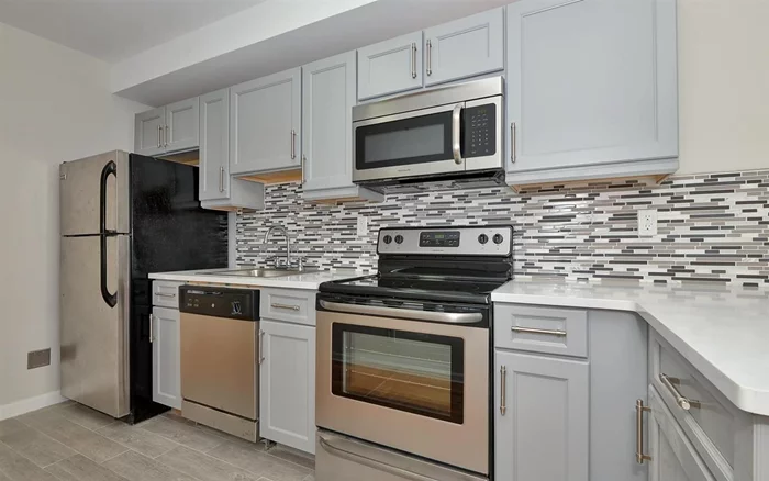 Welcome to this beautifully renovated bright one bedroom home offering sleek & contemporary maple cabinets with soft close drawers; stainless steel appliances, Ceasarstone counters & mosaic backsplash; upgraded bath with subway tiles, hardwood floors throughout & terrace for outdoor enjoyment. Shared laundry in building, Easy access to transportation, shopping &restaurants. Perfect for 1st time home-buyers & investors.