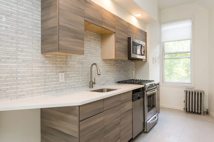 This 1BR+Den/1BA has charm & character. Your eat-in kitchen opens into your living room. The den area before the bedroom is great for an office/nursery. Bathroom boasts of a glass enclosed shower. Unit is accented with gorgeous exposed brick & HWFs. Unit is on 1st flr & has an intercom system. Coin operated W/D ONSITE. Common backyard is great for relaxing & entertaining! Close to PATH, bus, light rail restaurants, shops and more!