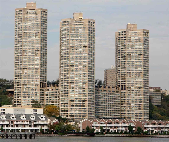 Come see one of the largest 1 bedroom layouts at 1003 sq.ft. in The Galaxy Towers on Blvd East, with Amazing East and North East views of NYC and the Hudson River from the 79th st. boat basin to the GWB!. The layout has 1.5 baths and a nice entry foyer leading to a large living room that easily fits a large dining room table to make a separate dining area. The beautiful views of NYC can be seen from every window from the living room and the bedroom! The spacious bedroom fits a king size and plenty of large furniture and an area for a small office or sitting area where you can enjoy the views. The maintenance fee includes your utilities, gas, electric, heat, and a/c, as well as use of the indoor and outdoor pool, large gym facilities, common room, tennis courts and much more! Parking available for $120/mo in an indoor garage. Many shops on premises.