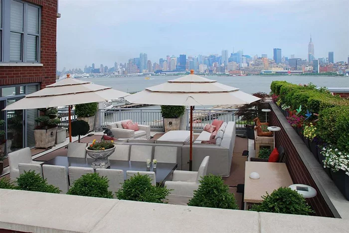 The ultimate in Luxury Living at Maxwell Place. 2 Br 2.5 bath with approx. 1000 SqFt private outdoor terrace with Direct NYC and Hudson River Views. This home spans from the NE corner to the SE corner and is unmatched in view and outdoor space by any other home in the Maxwell Community or Hoboken. Master Suite is located on NE corner with views of the GW Bridge and all of Midtown. Living, dining and sitting rooms all have direct Views of Manhattan. Chef's kitchen features granite counters, SS appliances, custom cabinets and custom lighting. Upgrades galore throughout the home include: Custom ceiling moldings, custom inlaid lights by Fios, Hunter Douglas electronic window treatments, Savant smart home technology system that operates, lights, window treatments and music, all closets have custom organizers, in wall speakers in every room. Landscaped roof terrace also has speakers, irrigation system and misting system. Community features 24 hr concierge, 2 pools, 2 gyms, community room w theatre and direct NYC views, landscaped roof terraces wth bbq's tv and fireplace, children's playroom. Commuter's dream with ferry around the corner or take the private shuttle to the path. Deeded parking included. Don't miss this once in a lifetime opportunity!