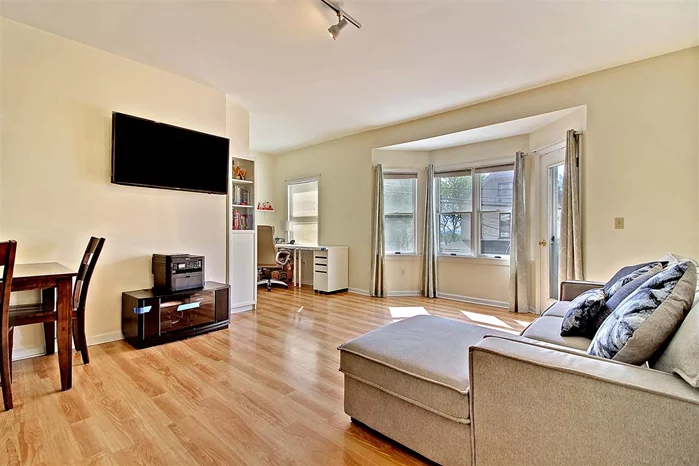 This 2 Br+Den - 2 Full Baths is priced to move. Living room has a nice open layout with Bay windows that Leads to your private terrace with beautiful sun set views. Hardwood floors though out, C/A, Forced Hot Air, W/D in unit and Deeded Full Size Garage Parking Spot. 2 Blocks for NYC Transportation.