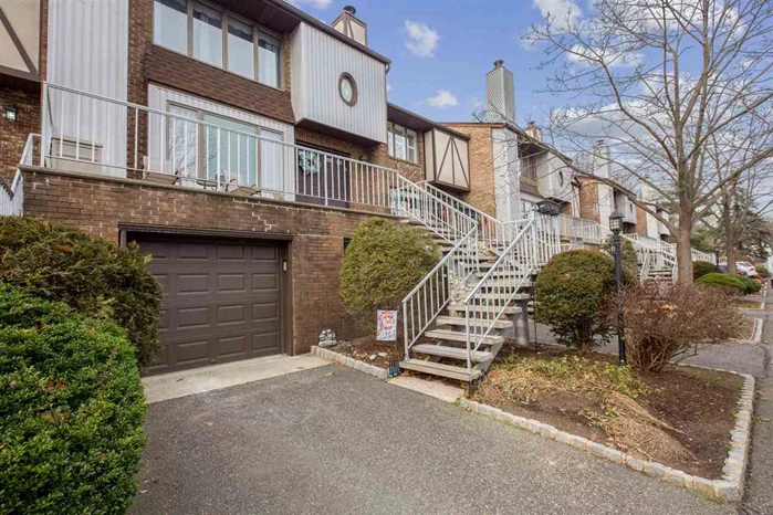 The Hamilton Crest is a beautifully landscaped townhouse community. Conveniently located in the Upper Montclair section of Clifton, this development is a short walk to & from bus transportation & easy access to major highways. This sought after model has a massive living room, separate dining room, upgraded kitchen & cozy fireplace. The spacious kitchen has a beautiful bay window overlooking a patio & SS appliances & granite counters throughout. The master bedroom has a beautiful en-suite bathroom. Just when you think this town home has everything, don't forget the laundry room, finished basement, private garage & guest parking.